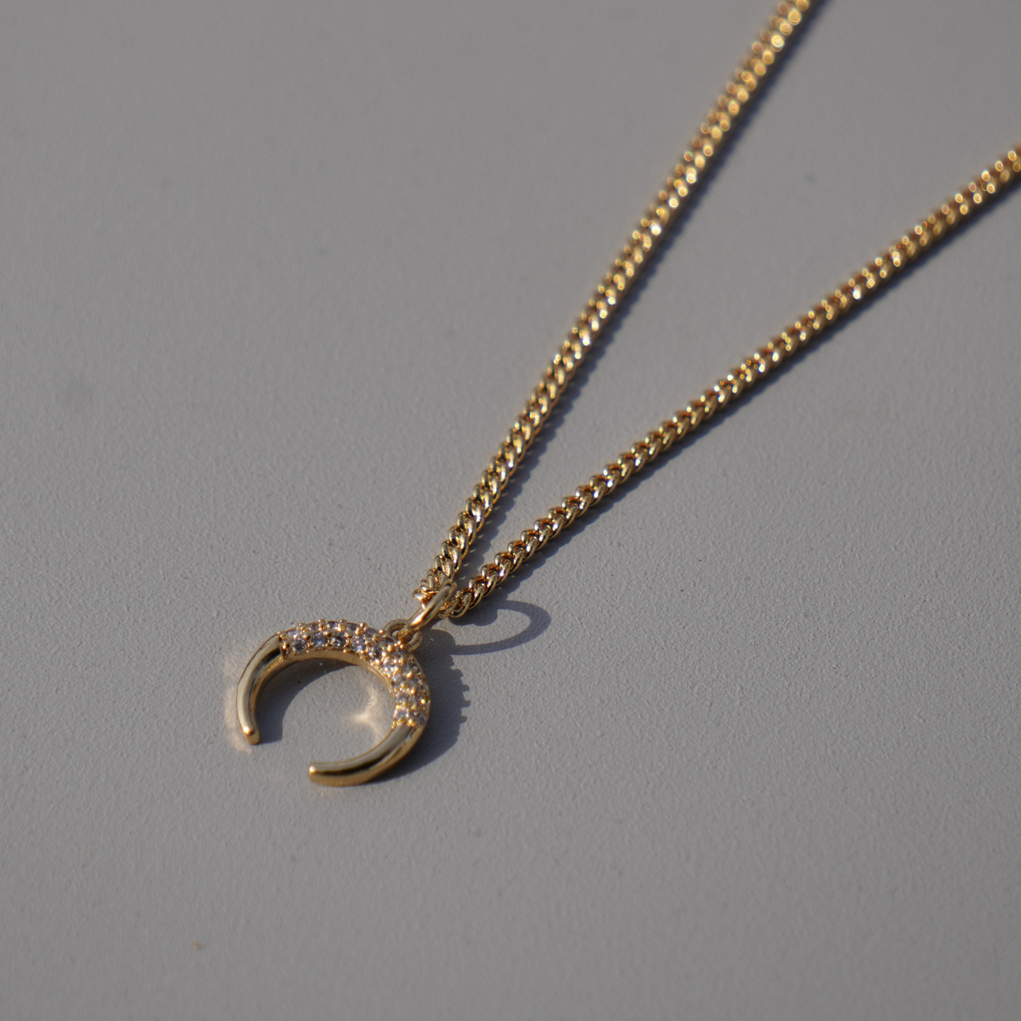 STB, DOWNWARD CRESCENT NECKLACE