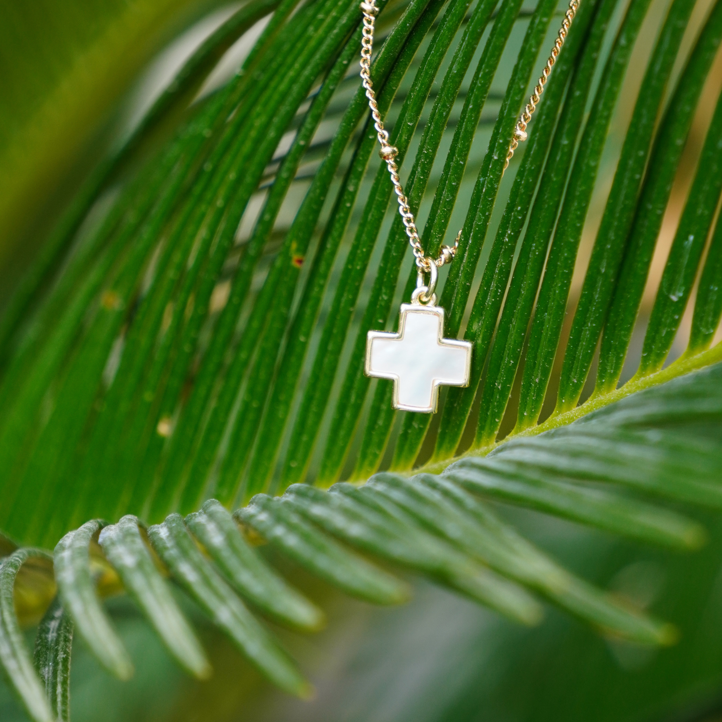 STB,  LUMIÈRE CROSS NECKLACE